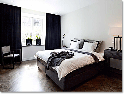masculine skandinavian bedroom with walnut flooring