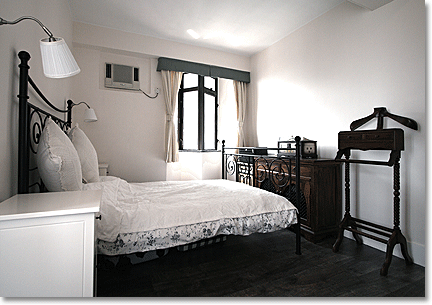 achromatic country bedroom in the city
