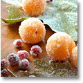 christmas table decoration with frosted fruit