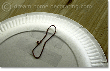 how to fix a paper plate to a wall