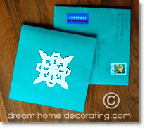 christmas card with paper snowflake decoration