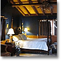 dark blue log home bedroom