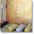 French bedroom with golden 'headboard