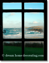 country cottage window overlooking the sea, Cornwall, UK