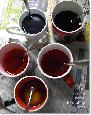 Easter egg dye vats: half-filled coffee mugs