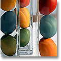 hand-dyed easter eggs in tall glass vases