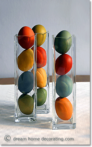 simple Easter centerpiece: dyed Easter eggs in narrow glass vases