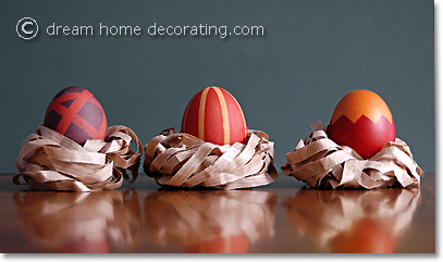 pattern-dyed brown easter eggs in paper nests