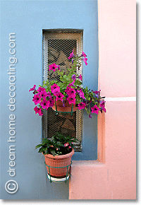 hanging flower basket in tiny window, Lago Maggiore, Italy
