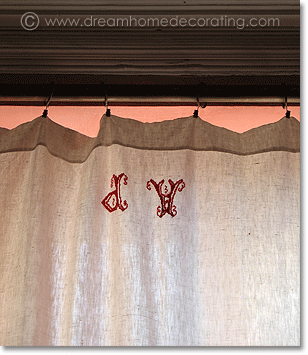 monogrammed antique linen curtain (formerly a bedsheet)