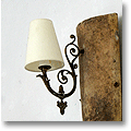 wall light mounted on an antique roof tile