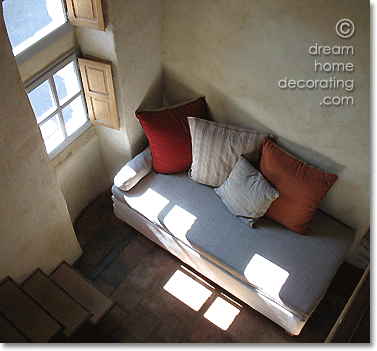 french farmhouse living room with a contemporary daybed and cushions