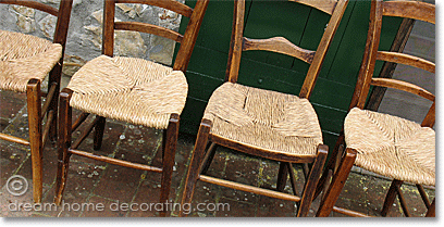 rustic Tuscan straw-seated chairs