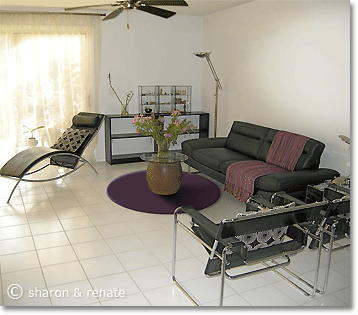 round area rug under antique Japanese drum as a coffee table