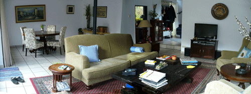 German living room with white walls and white floor tiles