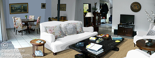 floral, feminine living room with white walls and white flooring