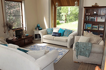 living room in neutrals with turquoise accents