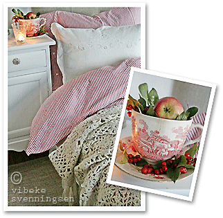 Bed in a Norwegian home, apples in a transferware coffee cup