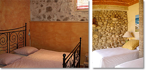 Mediterranean style bedrooms with sandstone/pebbles and orange walls