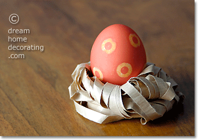 Easter egg in a paper nest made of crushed paper strips