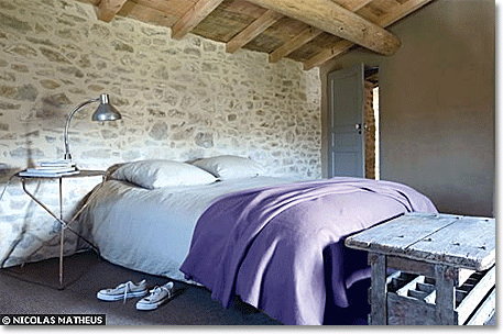rustic purple and sandstone bedroom