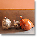 ceramic fowl in a grey/salmon color scheme