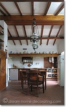 tuscan farmhouse kitchen in neutrals with beamed ceiling, Province of Pisa, Tuscany, Italy