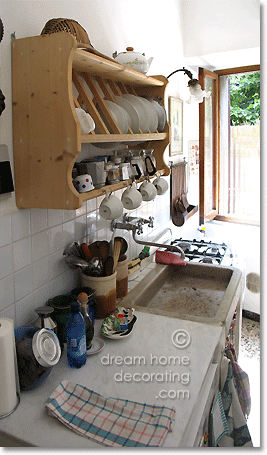 Tuscan townhouse kitchen with terrazzo flooring and stone sink, Province of Siena, Tuscany, Italy