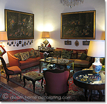 Tuscan palazzo living room in warm greens, yellows and reds, Volterra, Tuscany, Italy