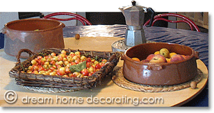 Italian table setting with fruit bowl, basket and stovetop espresso maker