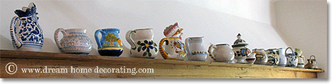 majolica jugs lined up on a Tuscan kitchen wall