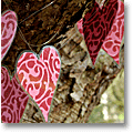 Valentine Day outdoor decoration: garland made of laminated fabric hearts