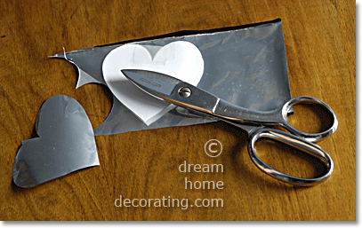 homemade valentine ideas: door hearts made from recycled coffee bags. Step 1: cut out the heart shapes