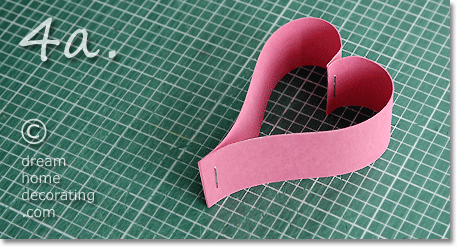 Pink heart made of paper strips