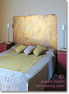 golden 'headboard' painted on a French bedroom wall