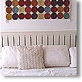 simple white sofa with textile wall art