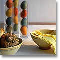 Easter table centerpiece made from hand-dyed Easter eggs in tall glass vases