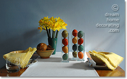 simple Easter table centerpiece: dyed Easter eggs in narrow glass vases