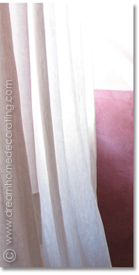 white linen curtain with a patch