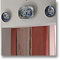 blue and white transferware plates above a French doorway