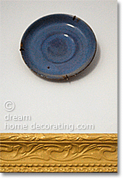 simple plate above a painted French picture frame