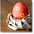 Easter egg in a nest made of paper strips