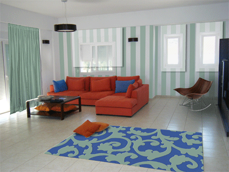 contemporary greek living room in white, cream, burnt orange jade and blue