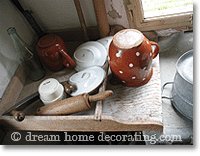 wooden washboard with antique earthenware crockery