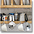 stovetop espresso makers on a Tuscan kitchen shelf