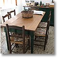 tuscan dining room furniture in the kitchen of an old San Gimignano townhouse, Province of Pisa, Italy