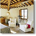 Tuscan bedroom with open-beam ceiling