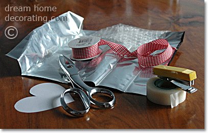 valentine's day crafts for your door: silver hearts made of recycled coffee bags