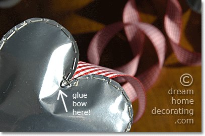 front door decoration with silver valentine hearts: where to place the glue for the bow