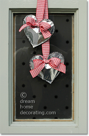 valentine door decorations: silver hearts made of recycled coffee bags turned inside out